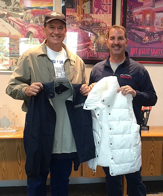 Mike Hix, senior vice president with First Independent Ban, left, wth Mike Whan, executive director of Hot August Nights, with a pair of the items donated this year.