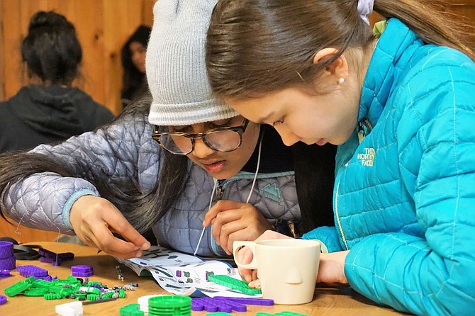 Two Northern Nevada girls work together during the inaugural Girls in STEM camp in 2018.