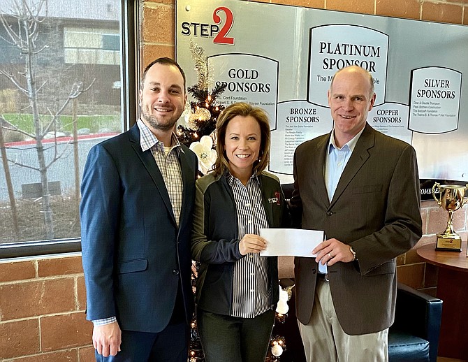 From left, Nick Rowe, Bank of America Senior Vice President and Reno Market Manager; Mari Hutchinson, CEO of STEP2; and Andrew Diedrichsen, Reno Market President for Bank of America with the $50,000 check.