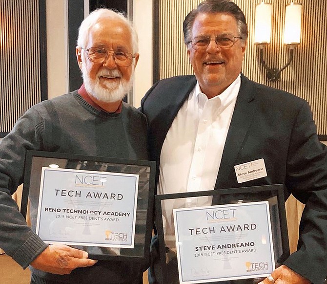 Nevada Technology Academy Business Development Executive Phil Holland, left, and Steve Andreano, director of technology programs, recently accepted the NCET 2019 Presidential Award for Technology award on behalf of the academy.