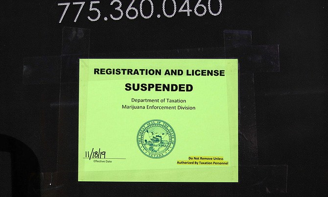 A sign on the front door of Certified Ag Labs, a marijuana testing lab located on Greg Street in Sparks, on Nov. 19, 2019.