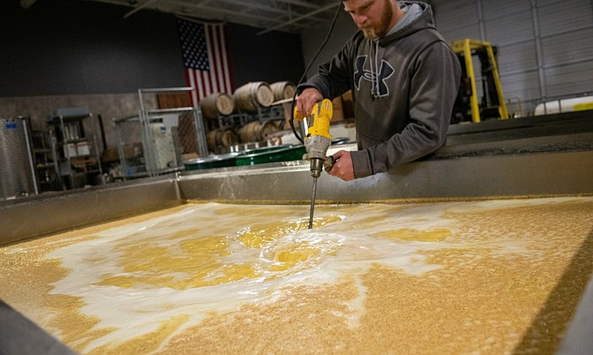 Nick Bietz, the assistant distiller at Seven Troughs Distilling Co. in Sparks, is seen on March 19. Seven Troughs has started making high-proof alcohol for use in hand sanitizer.