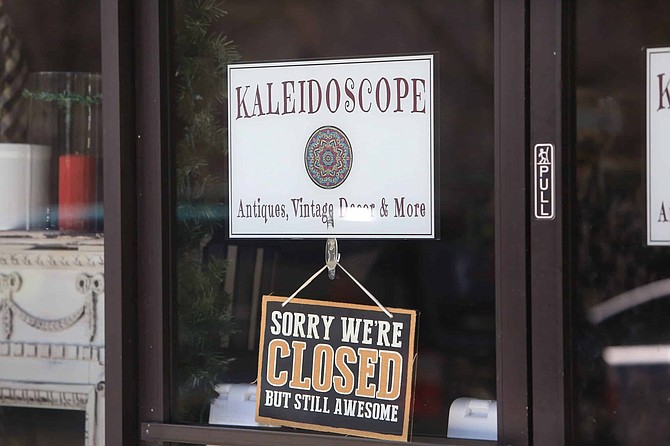A closed sign hangs on the front door of Kaleidoscope in downtown Carson City on Friday.