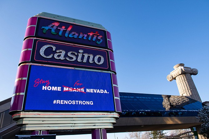 The marquee at the Atlantis Casino Resort Spa in Reno includes a message telling people to stay home during the COVID-19 pandemic on Thursday, March 19.