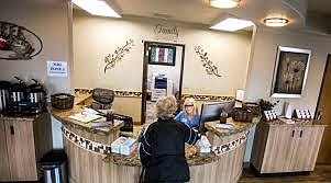 A receptionist checks in a patient at A+ TotalCare in Elko on Wednesday, April 4, 2018.

