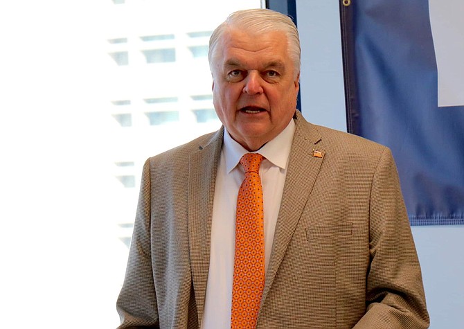 In this file photo, Nevada Gov. Steve Sisolak speaks at a Feb. 18, 2020, press conference in Reno about new companies relocating to the region.