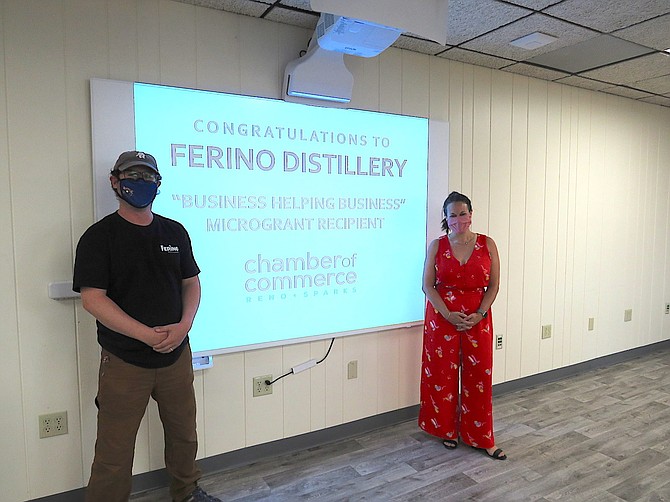 Joe Cannella, left, owner of Ferino Distillery, with Kristine Brown, Director of Member Engagement for the Reno+Sparks Chamber of Commerce.
