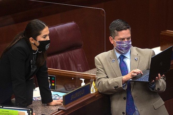Assembly members Sandra Jauregui, left, and and Steve Yeager and on Wednesday, Aug. 5, 2020 during the sixth day of the 32nd Special Session of the Legislature in Carson City.