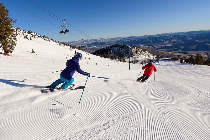 A couple skis down groomers in late 2019 at Mt. Rose Ski Tahoe near Reno.