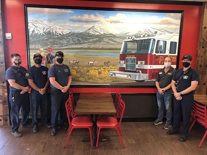 At right, local franchise owner Damon Kreizenbeck is photographed with Reno Fire Capt. Mike Hill and his team at the Damonte Ranch location of Firehouse Subs on Oct. 15.